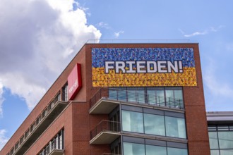 Modern architecture house in Berlin with a sign for peace. Modern architecture house in Berlin with