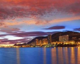 Alicante skyline at sunset from Albufereta beach in Spain Costa Blanca