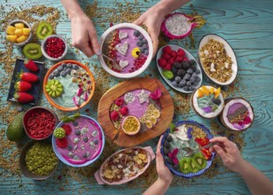 Acai bowl smoothie and Spirulina algae with chia berries and fruits healthy food