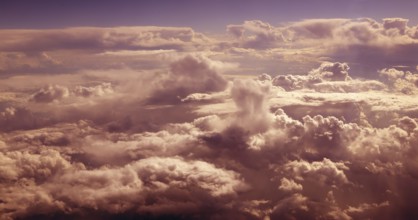 Orange cloudy sky aerial view from aircraft airplane