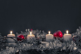 Advent time four candles burning with space for your content