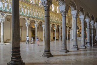 Tourists visit in the Basilica of Sant Apollinare Nuovo, Ravenna, Italy, Europe