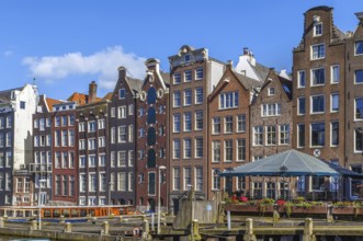 The so-called dancing house on the canal Damrak in Amsterdam, Netherlands