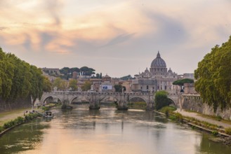 Sunset view of St. Peter's Basilica, Ponte Sant'Angelo, and Tiber River in Rome, Italy, Europe