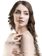 Young beautiful woman with reflection on water surface