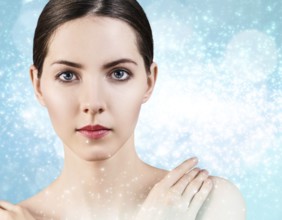 Portrait of young and beautiful woman over winter Christmas background. Spa concept