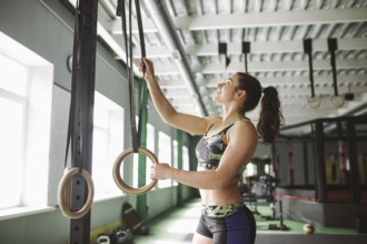 Dip ring beutiful girl woman muscle ups rings workout at gym