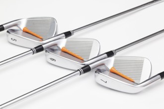Titanium golf clubs on the white background