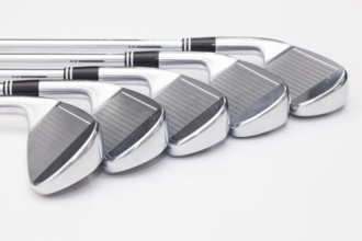 Titanium golf clubs on the white background