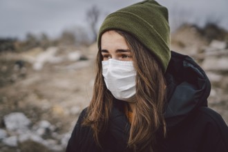 Portrait of young woman wearing medical mask, health protection from influenza virus, epidemic and
