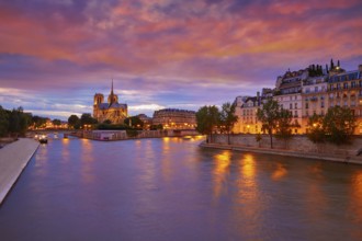 Notre Dame cathedral in Paris sunset from Seine river in France