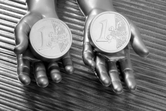 Two silver euro coins in futuristic robot gray metallic hands bank metaphor