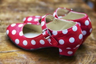 Red dance shoes with white dots