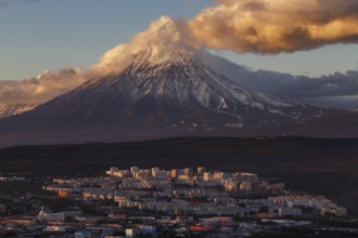 Evening colorful top view of townscape of Petropavlovsk-Kamchatsky City at sunset on background
