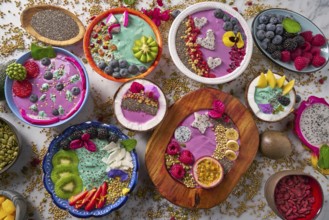 Acai bowl smoothie and Spirulina algae with chia berries seeds and fruits mix