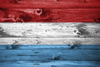 Luxembourg flag on wooden planks background wood flag