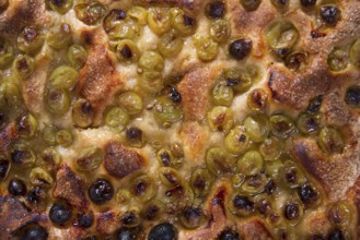 Sweet typical Tuscan focaccia with grapes strawberry white