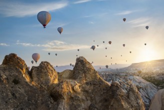 Flying on hot air balloons in Cappadocia at sunrise, Turkey, Asia
