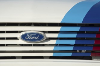 Nicosia Cyprus, October 29 2023: Classic ford car logo sign. Front view of white antique vehicle