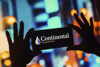 In this photo illustration, the Continental Resources logo is displayed on a smartphone screen