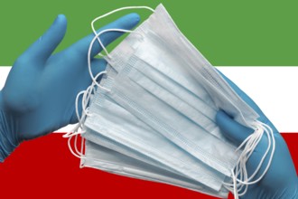 Doctor holding face masks in hands medical blue gloves on background national flag Islamic Republic