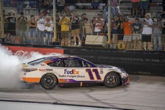 NASCAR Cup Series Driver Denny Hamlin (11) celebrates his win for the Bass Pro Shops Night Race at