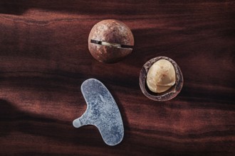 .Macadamia Nuts On Vintage Wooden Board
