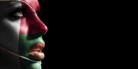 Madagascar flag painted on a face of a young woman, national flag on face