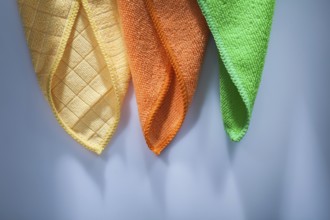 Set of new household dishrags on white surface