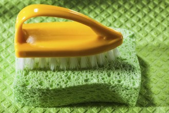 New plastic brush sponge on dishcloth