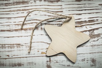 Vintage wooden star string on wood board celebrations concept