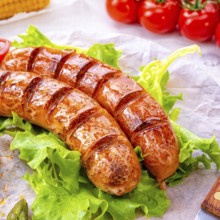 Grilled krakauer sausage with boiled corn and green salad