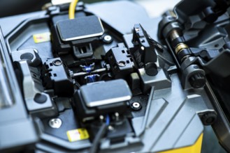 Device for mounting optical cable. Optical internet Technology concept. Optical fiber assembly