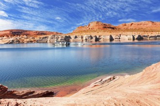 Lake Powell. The coast is cut by narrow canyons. USA. The smooth emerald water of the lake