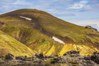 Incredible shades of rhyolitic mountains - yellow, orange, green and blue. Summer volcanic tundra.