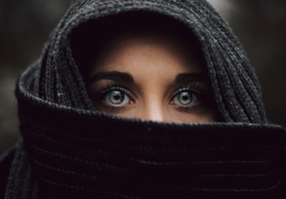 Portrait close up of veiled muslim blue eyed young girl