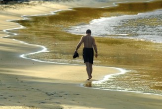 Tourist dawn walk in the beach at Kovalam kerala India