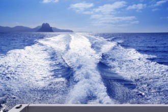 Es Vedra islet and Vedranell islands with boat wake in mediterranean Spain