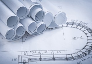 Pile of construction blueprints building and architecture concept