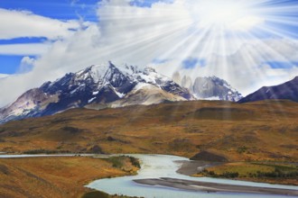 Beautiful summer morning in Patagonia.The river and the snow-capped mountains illuminated by the