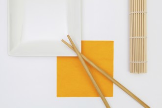 Top View Of White Empty Sushi Plates With Bamboo Chopsticks. Symmetry Food Design