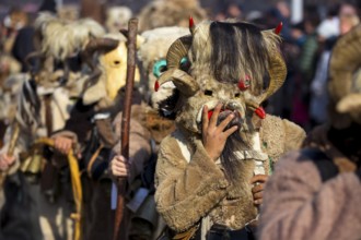 Participants take part in the International Festival of Masquerade Games Surva. The festival