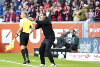 Head coach / coach Julian Schuster (SC Freiburg) whistles his players back from the sideline during
