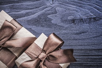 Packed gift boxes on wooden board holidays concept