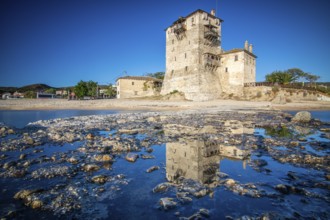 View over a jetty into the sunset. Landscape taken with the historical landmark of the Byzantine