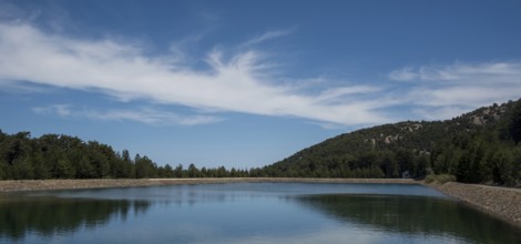 Panoramic view of dam full of water in the forest, Prodromos water reservoir Troodos mountains