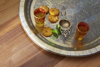 Green tea with mint Moroccan style on silver tray and biscuits