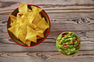 Guacamole with avocado tomatoes and nachos mexican food