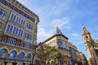 Valencia Casa Isla de Cuba and Santa Catalina tower church in La Paz street of Spain