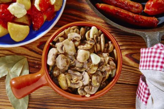 Tapas from Spain champinones mushrooms with potatoes and sausage